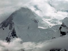 17 Gasherbrum I and Gasherbrum I South Close Up The next morning we started our trek from Shagring Camp to Gasherbrum Base Camp in mostly cloudy weather. After 30 minutes we reached Gasherbrum Corner at the junction of the Upper Baltoro Glacier with the tributary Abruzzi Glacier. Gasherbrum I and Gasherbrum I South lie straight ahead. Gasherbrum I (8080m) is the 11th highest mountain in the world. Gasherbrum I was first climbed by July 5, 1958 by Americans Pete Schoening and Andy Kauffman. Gasherbrum I South (7069m) was first climbed by Maurice Barrard and Georges Narbaud via the Southwest Ridge in July 1980 on their ascent of Gasherbrum I